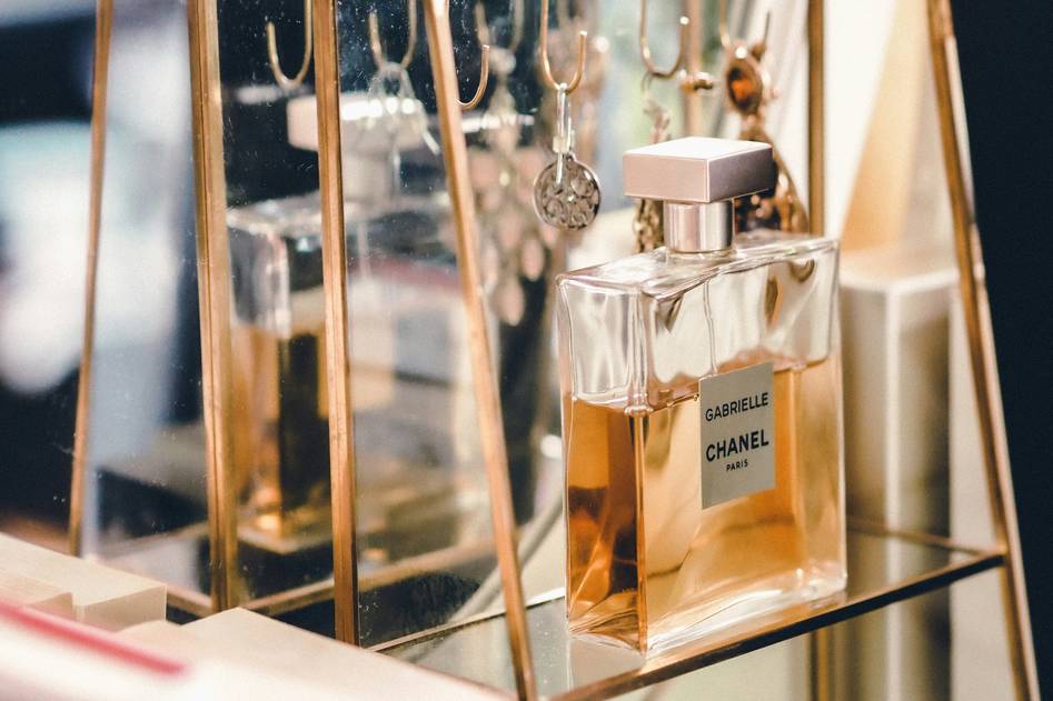 Elegant cologne bottle on marble with soft lighting