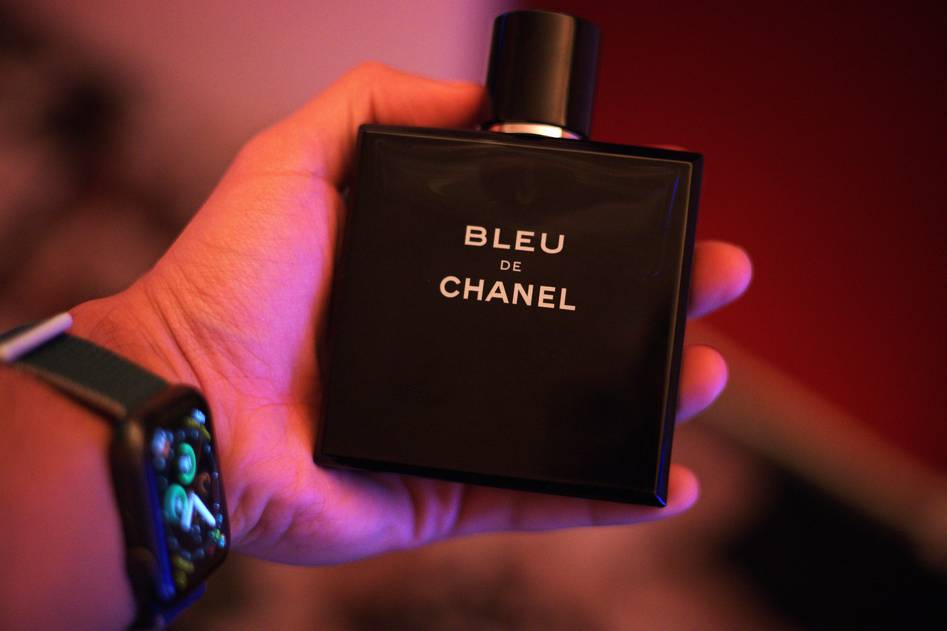 Man applying cologne in refined grooming routine