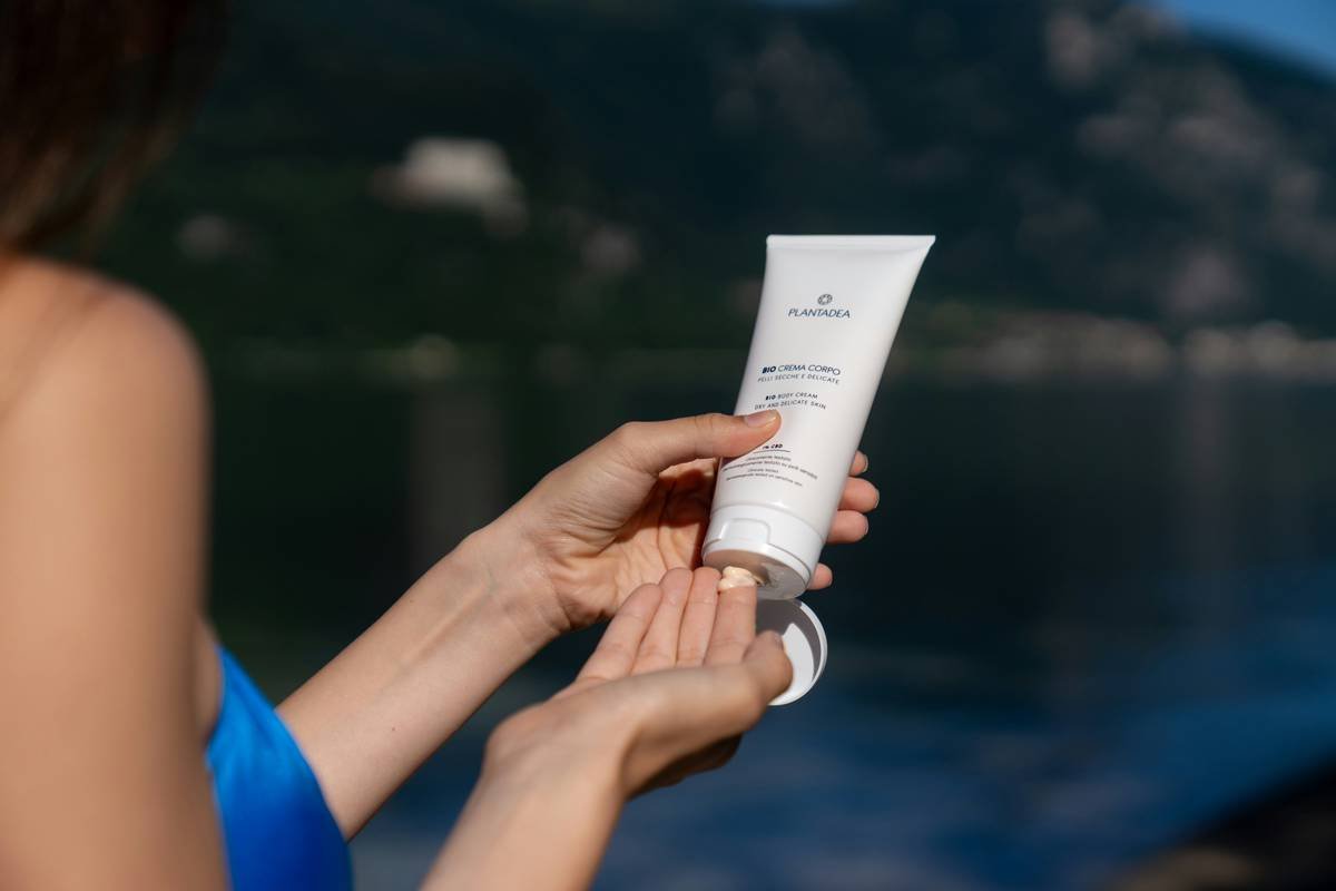 Close-up of kelly bb cream moisturizer bottle with texture swatch on hand