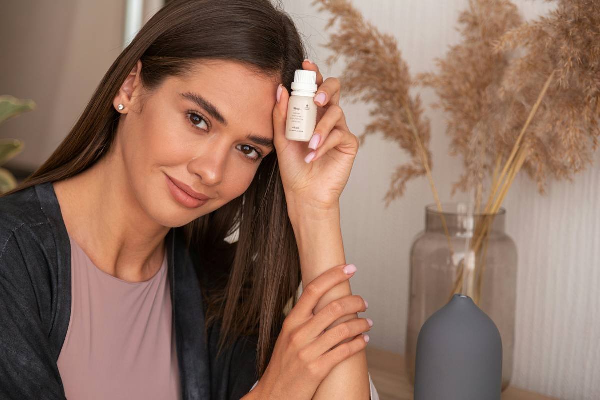 woman applying body moisturizer sensitive skin after shower